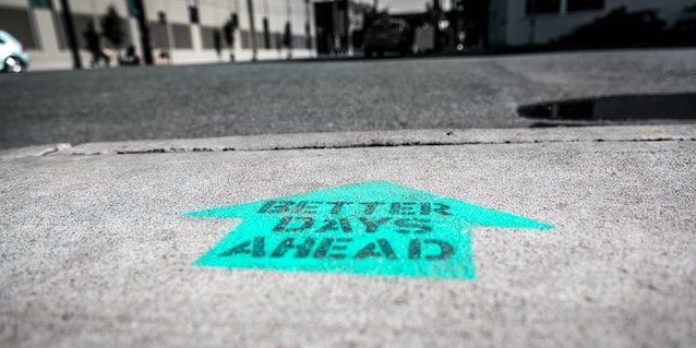 graffiti arrow on floor with positive message