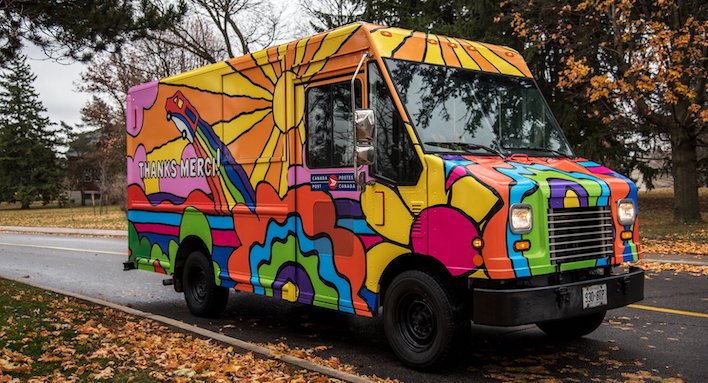 psychedelic post truck driving down road